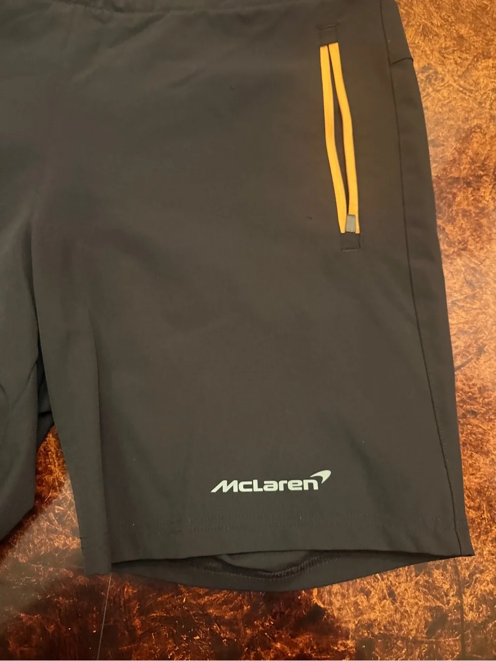 Castore x McLaren Men's Black Athletic Shorts with Yellow Zip Accents
